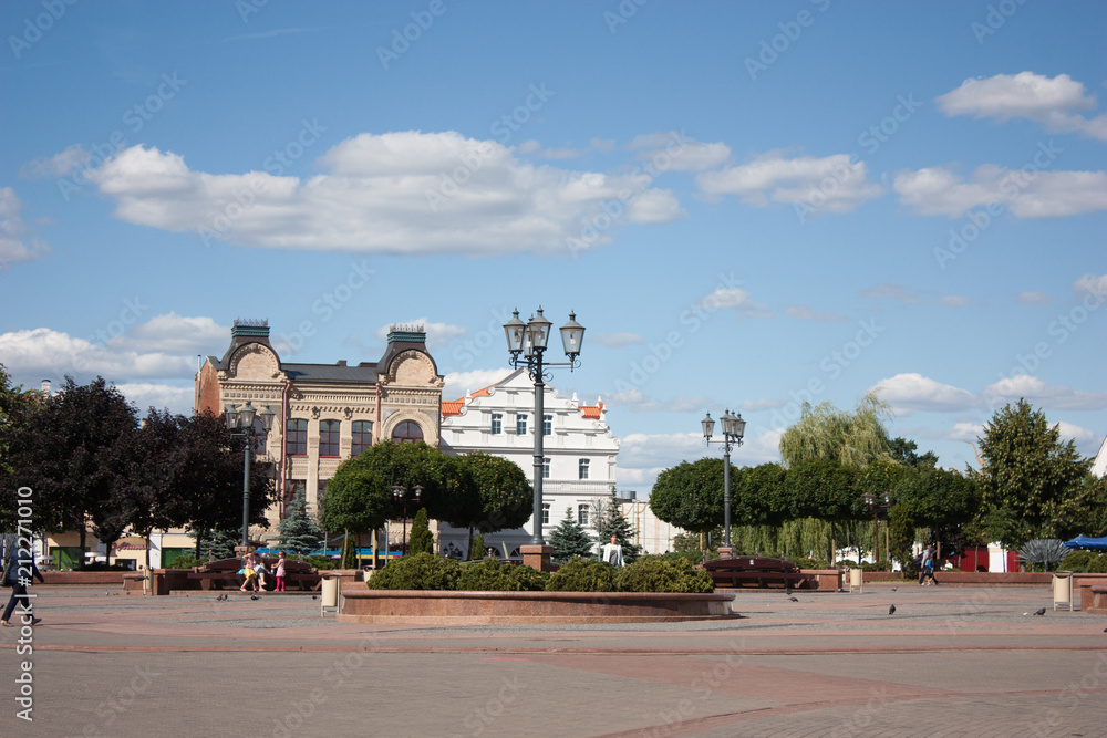 Sights and views of Grodno. Belarus. Summer landscape with a city park, passers-by and surrounding houses.