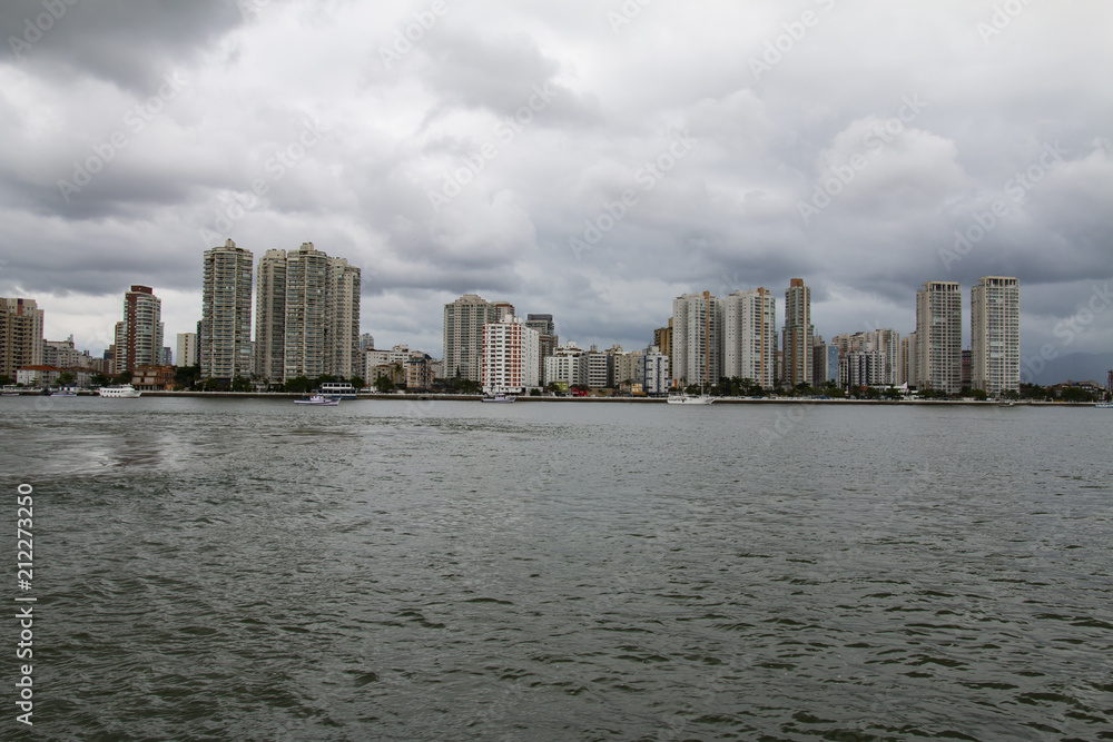 City with buildings and beach at the same time, city of Guaruja, beach South America, Brazil 