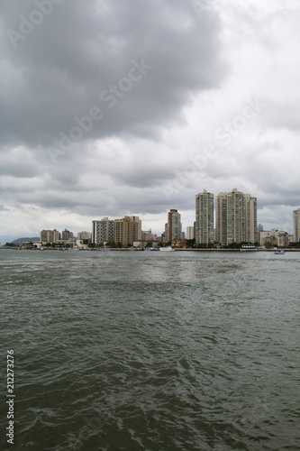 City with buildings and beach at the same time, city of Guaruja, beach South America, Brazil  © Ranimiro