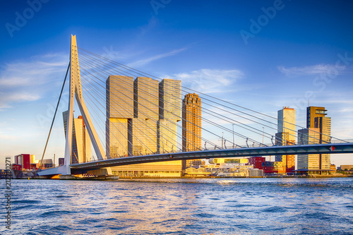 Famous Travel Destinations. Attractive View of Renowned Erasmusbrug (Swan Bridge) in  Rotterdam in front of Port and Harbour. Picture Made Before the Sunset. photo