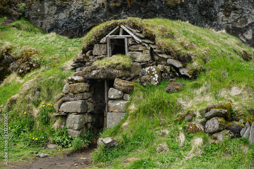 Old huts with green roofs in the rocks in DRANGSHLID