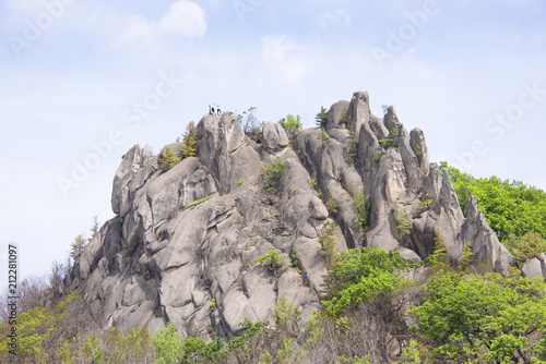 Obraz na plátne Weekend routes/ Climbers on top of the mountain dragon in the Lazovsky region of the Primorsky territory of Russia