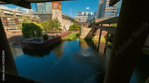 Wide angle shot featuring a Roman Fort and the St Giles Cripplegate Church in the Barbican area of the London Wall, England, UK photo