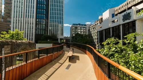 POV shot along a suspended concourse in a complex of corporate buildings in the Barbican and London Wall business district photo