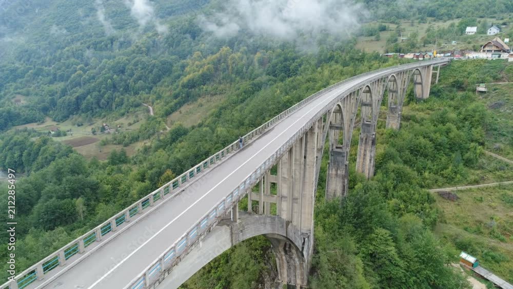 Slow drone shot flying over tall Durdevica bridge in Montenegro Slow drone shot flying over tall Durdevica bridge in Montenegro