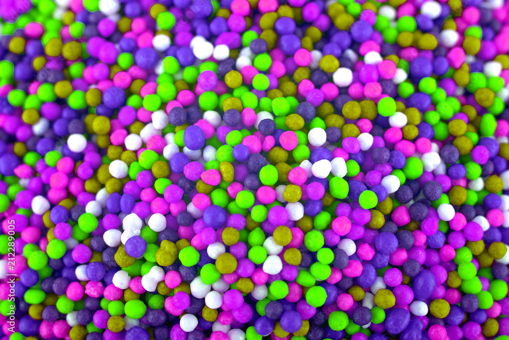 Colorful candies background, copy space. Nuts in multi-colored glaze dragee. Sweet candies spreading pastry decoration. Pile of colorful coated candy. Sweets  texture, pattern. Top view, flat lay