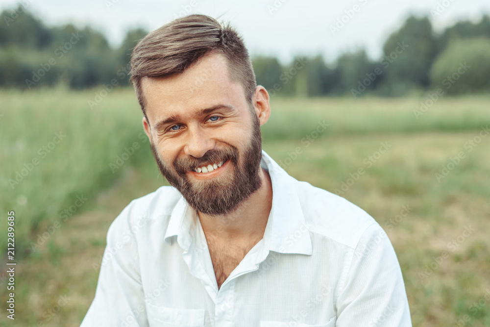 the man in the shirt on the grass