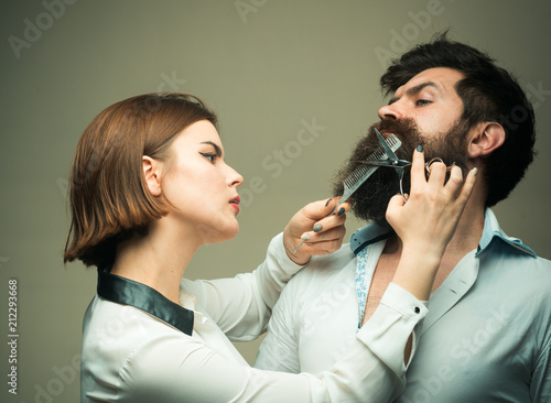 Beard care tricks keep facial hair look resplendent. Choose final style. Match beard to your face shape. Girl barber with scissors cutting hair of brutal bearded hipster. Barber expert grooming tips
