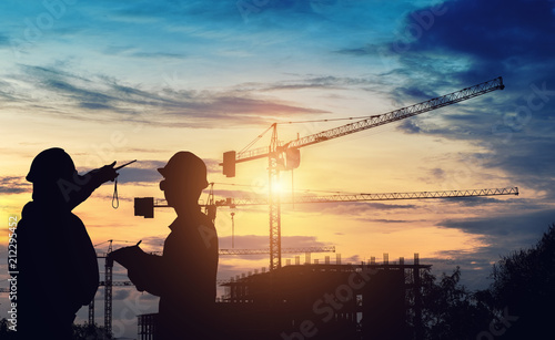 Silhouette engineer standing work on construction.