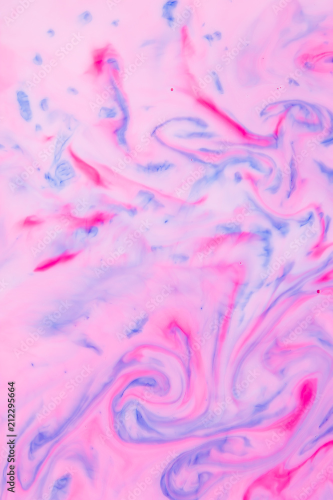 Abstract pink blue background on liquid, texture with paints, multicolored pattern for designer, abstract pattern from food dyes on milk, blank for designer