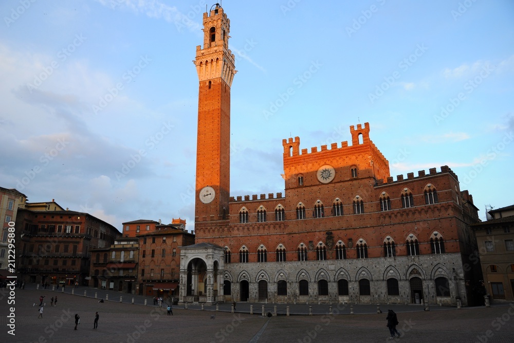 Sunset view of Piazza del Campo Square and Palazzo Pubblico City Hall in Siena, Tuscany, Italy