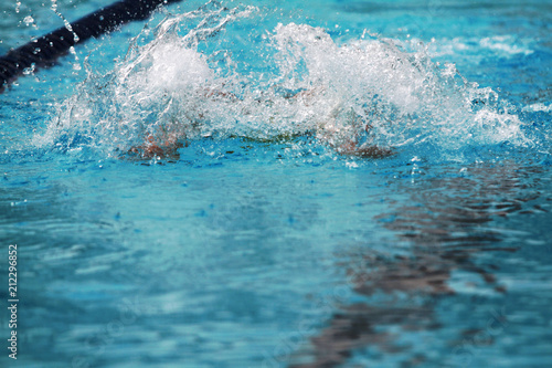 Water splash from swimmer swims in the pool © wibulpas