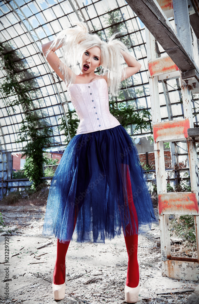 Portrait of cute strange freak girl. Attractive weird woman wearing motley  corset, tights and tutu skirt in ruined place. Odd fashion Stock-Foto |  Adobe Stock