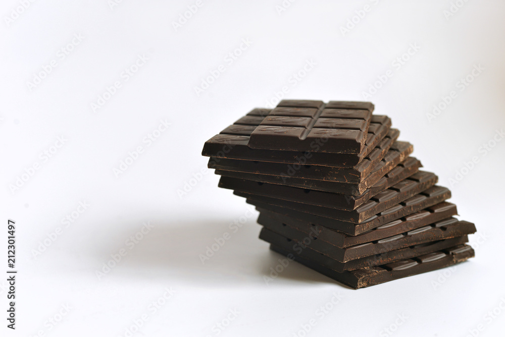 Chocolate on a white background. Bitter chocolate and cocoa. Still life with chocolate. Chocolate on a white background. Bitter chocolate and cocoa. Still life with chocolate.