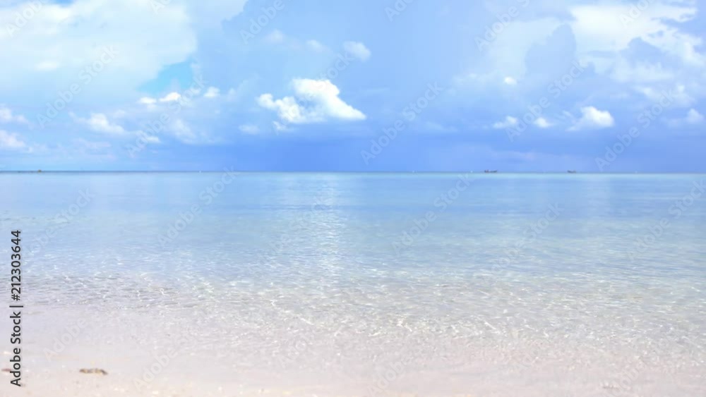 Amazing tropical beach. Ocean waves and cloudy sky background. White sand and crystal-blue sea. slow motion. 3840x2160, 4k Amazing tropical beach. Ocean waves and cloudy sky background. White sand and crystal-blue sea. slow motion. 3840x2160, 4k