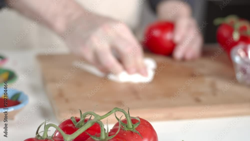Chef wiping down cutting board Chef wiping down cutting board