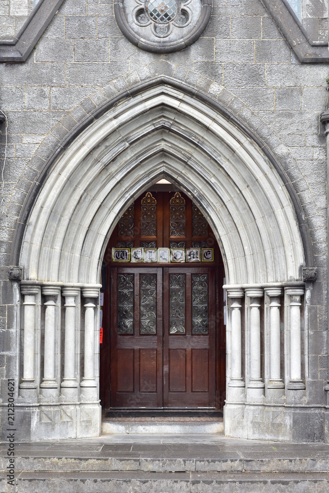 Stone portal in early English style of Roman Catholic church of St Michael in Tipperary.