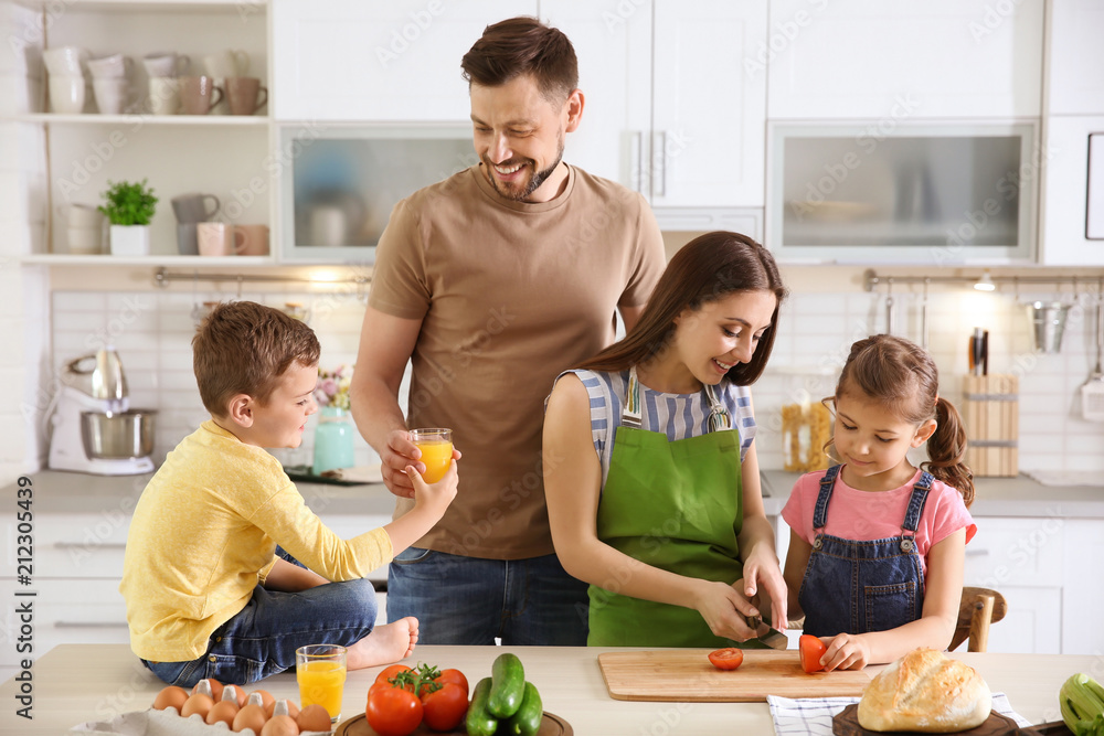 Happy family with children together in kitchen Happy family with children together in kitchen