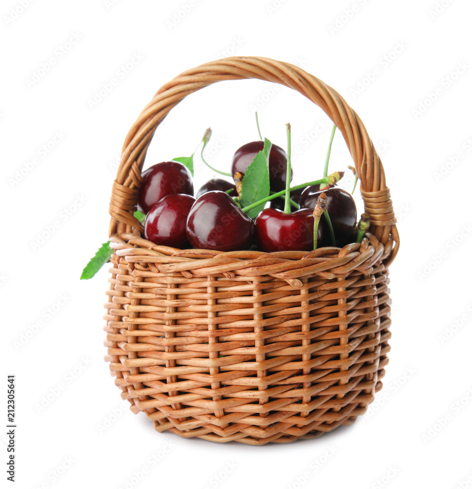 Wicker basket with sweet red cherries on white background Wicker basket with sweet red cherries on white background