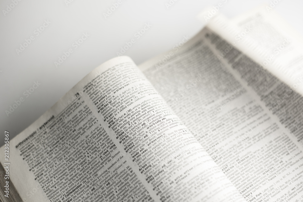 opening text book on white background opening text book on white background