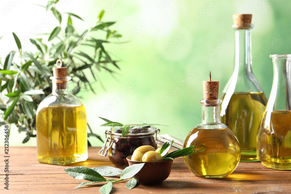 Composition with fresh olive oil on table Composition with fresh olive oil on table