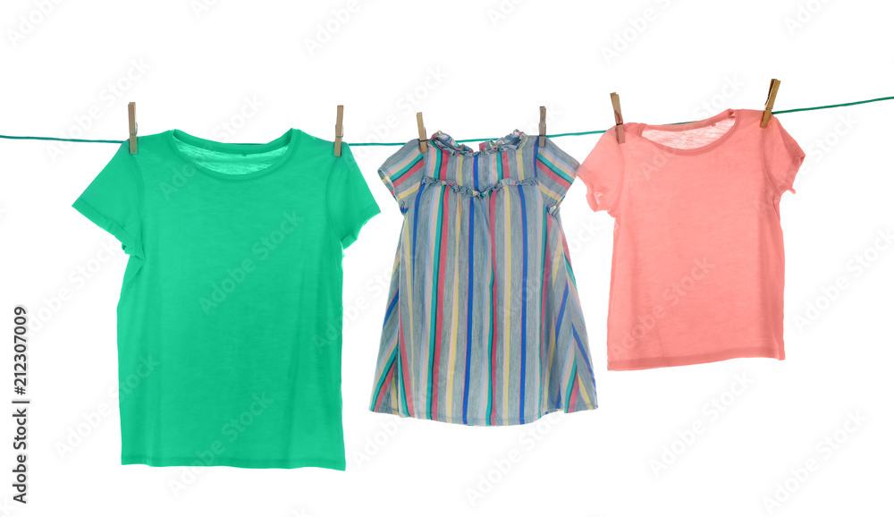Clothes on laundry line against white background Clothes on laundry line against white background
