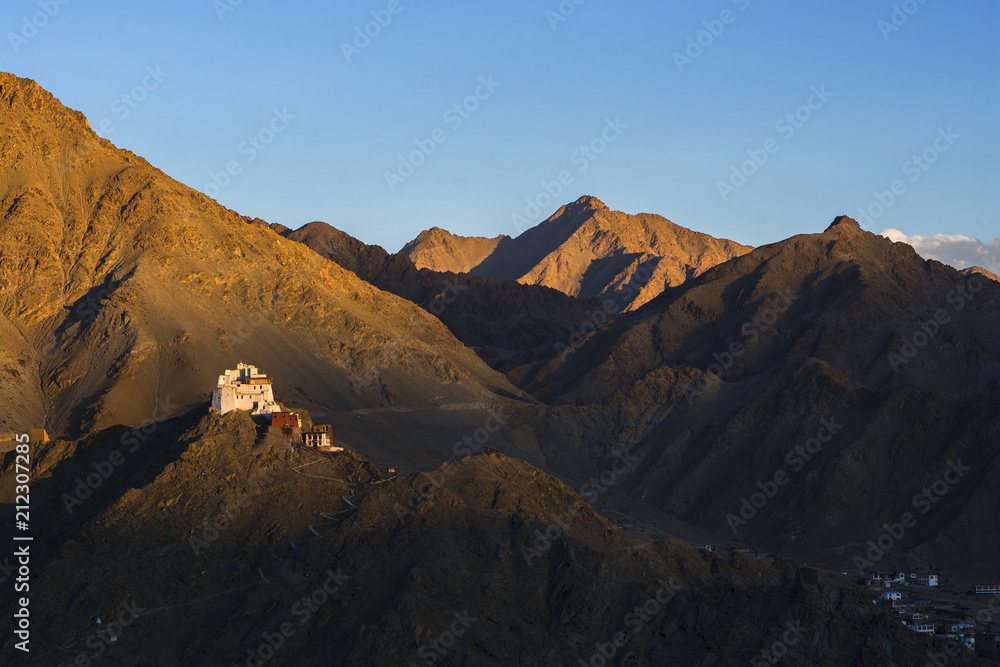 Brown hills in Leh city, India. Mountains and clear blue sky at twilight.