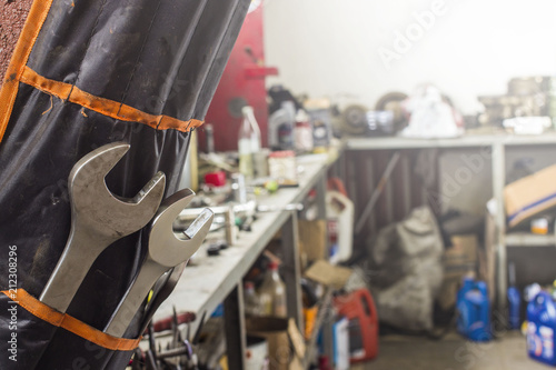 Wrenches in a case on a blurry background of the workplace of an auto mechanic © Torkhov