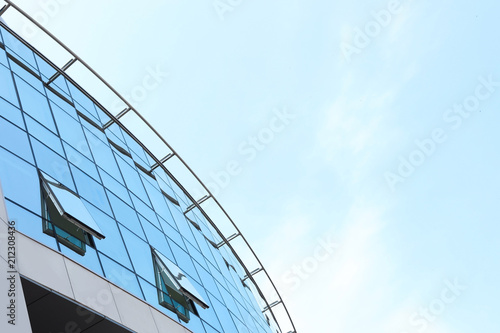 Building with tinted windows, outdoors. Modern architectural design