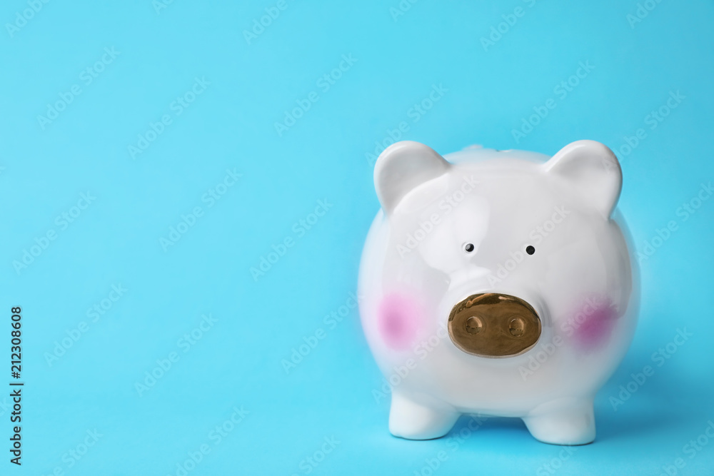 White piggy bank on color background. Money saving White piggy bank on color background. Money saving