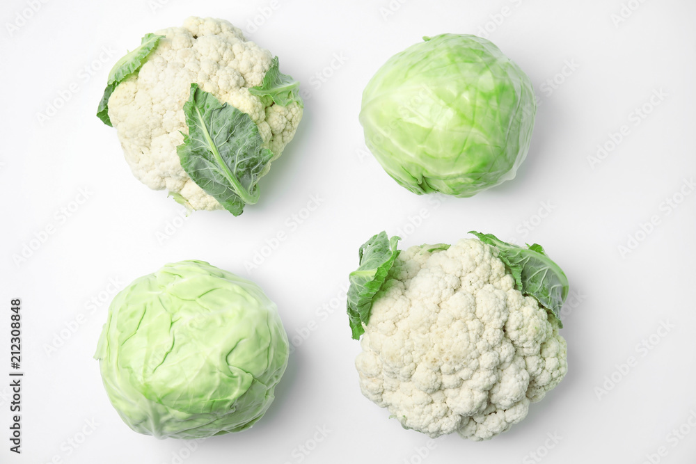 Obraz premium Flat lay composition with ripe cabbages on white background