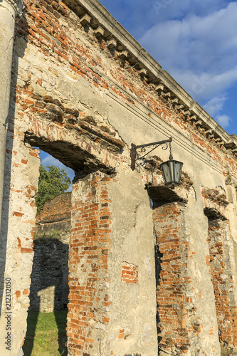 Ruins of 18th century classical palace, manor complex, situated on the Nida River near Jedrzejow, Sobkow, Poland photo