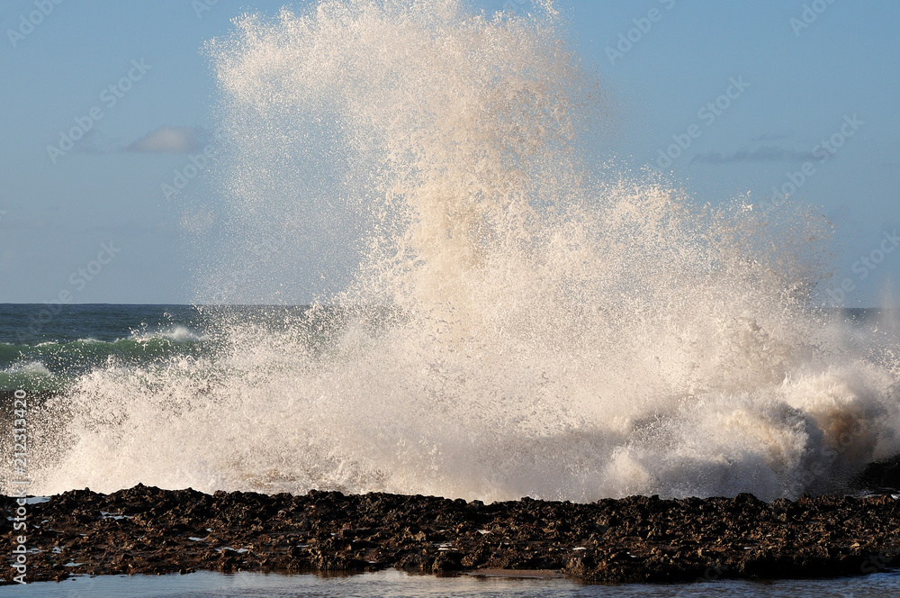waves crashing on rocks at atlantic ocean