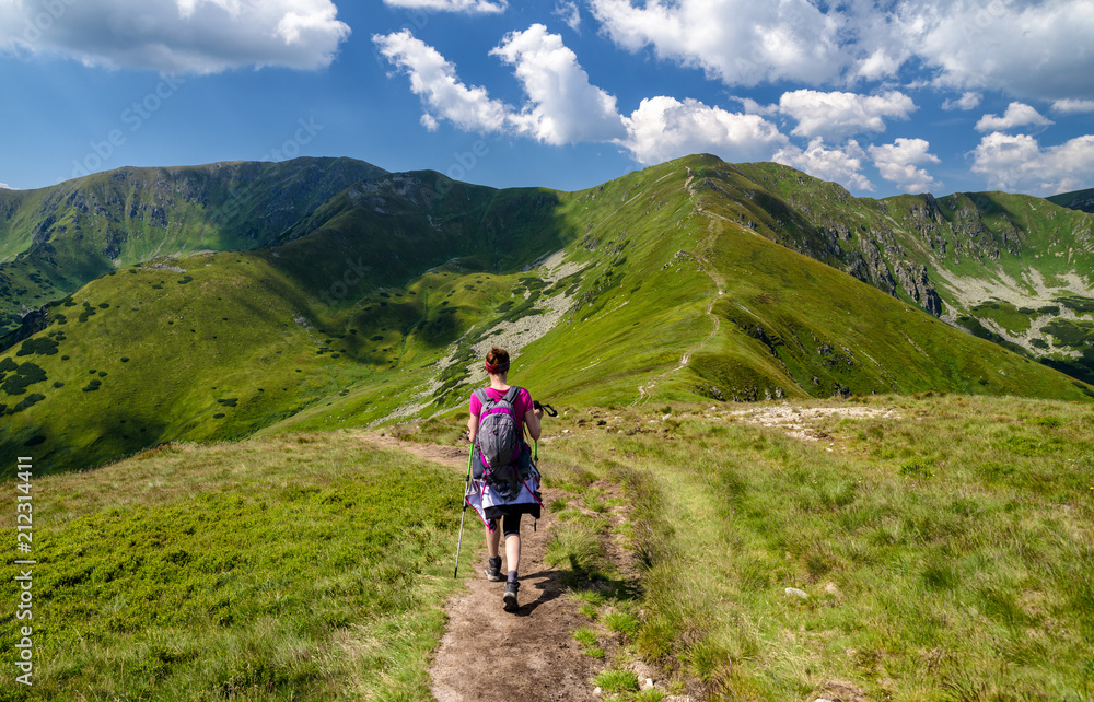 Walking woman hiking on the mountains