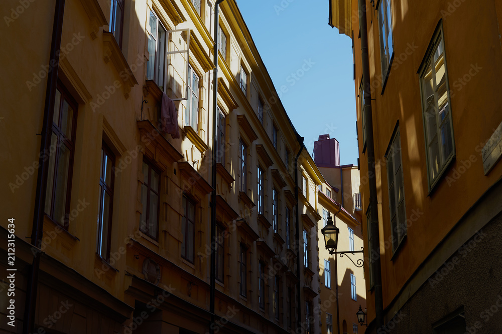  Sunlight and shadows in the narrow street in Stockholm, Sweden