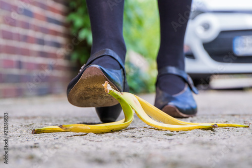 Konstfotografi a pedestrian will slip on a discarded banana peel
