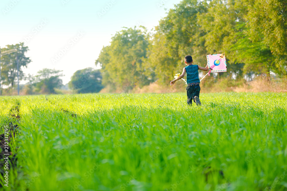 indian child playing with kite