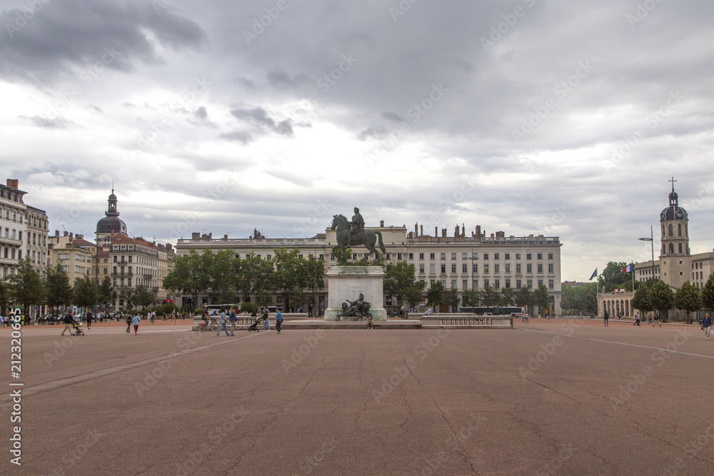 LYON, FRANCE - June 11, 2018 : View Bellecour square with a bronze equestrian statue of Louis XIV in the center, 1825. Lyon Place Bellecour statue of King Louis