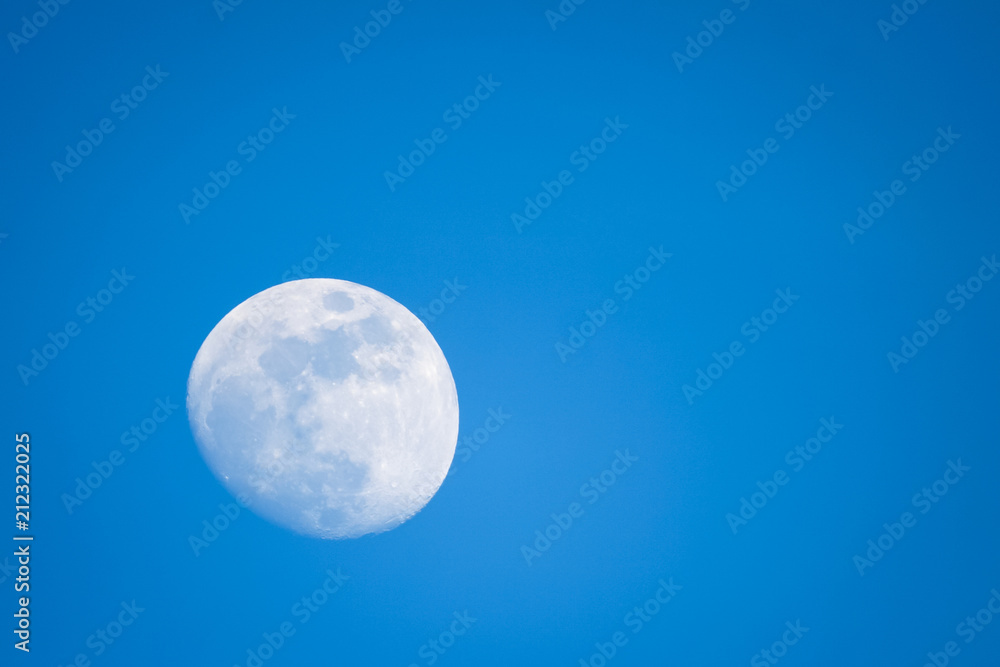 Full moon in blue sky background. Full moon in blue sky background.