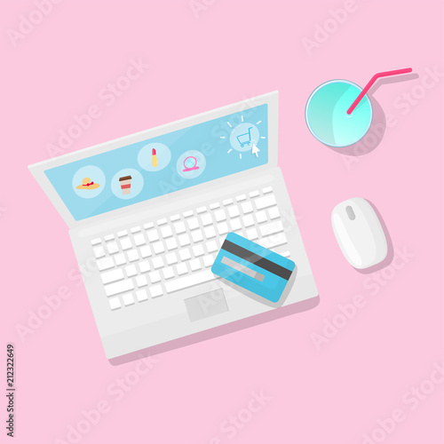 Online shopping with laptop and juice on pink background