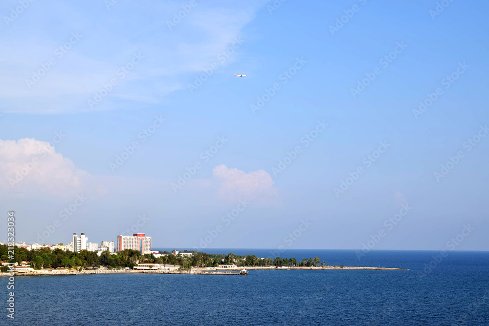 Famous tourist destination, beautiful sea panorama landscape. Sunny summer day with blue sky and green trees, Antalya, Turkey. Famous tourist destination, beautiful sea panorama landscape. Sunny summer day with blue sky and green trees, Antalya, Turkey.