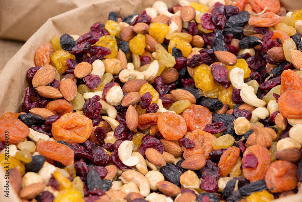 Assorted nuts and dried fruits.Healthy food background Assorted nuts and dried fruits.Healthy food background