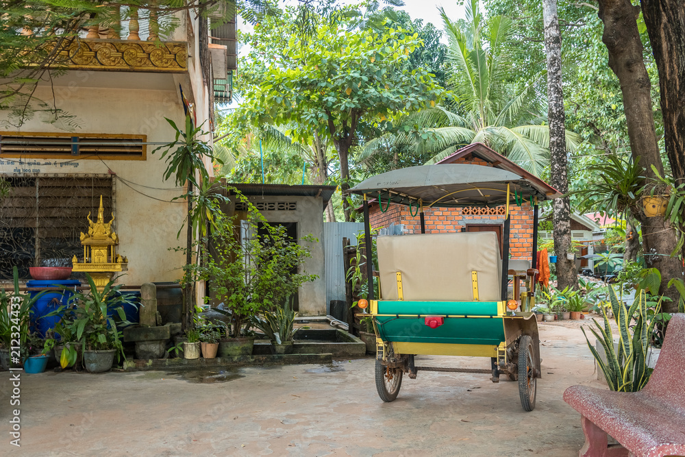 tuk tuk in a magical and abandoned buddhist temple in cambodia