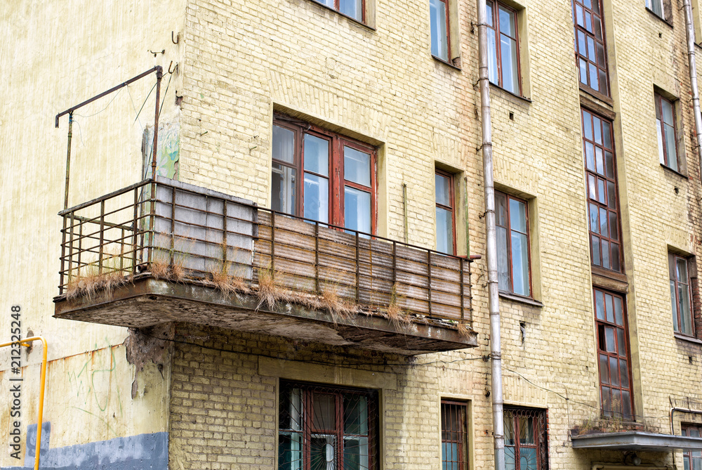 Old brick house with balcony Old brick house with balcony
