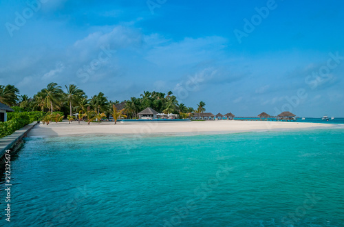 The perfect beach. Beach bungalow. Luxury escape. Tropical paradise. Honeymoon at Maldives. Palms and white sund. Blue ocean 