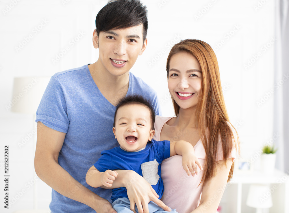 Portrait of young asian family with baby