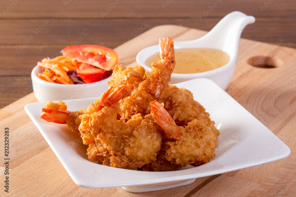 Fried prawn balls with sweet sauce on wooden table Fried prawn balls with sweet sauce on wooden table