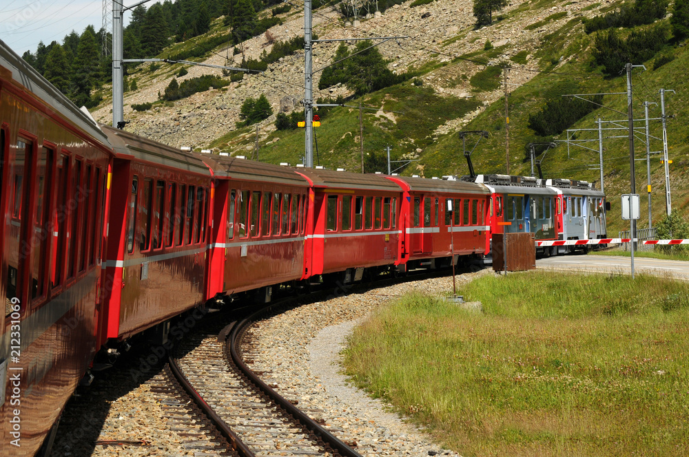 Naklejka premium The famous swiss mountain red train Bernina Express from Tirano to St.Moritz during summer season
