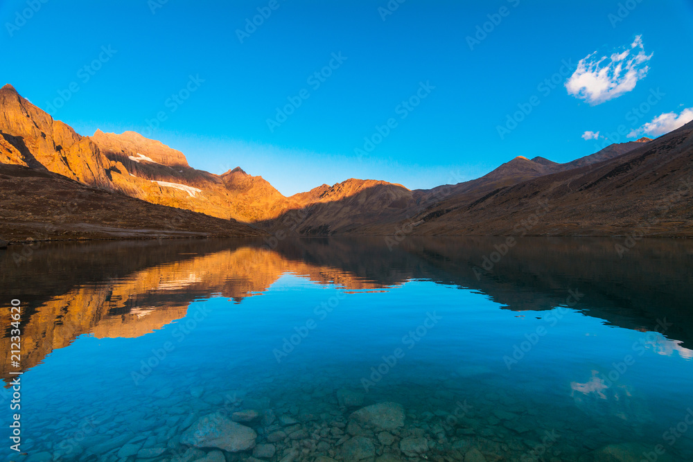 A beautiful view of Gangabal lake reflection in dry season with clear blue sky in a morning from Kashmir The Great Lakes Trek, India.