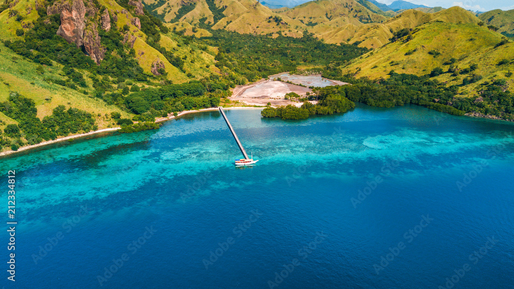 Aerial view of Marijite Bridge, a wooden pier in front of the private island from Komodo Island (Komodo National Park), Labuan Bajo, Flores, Indonesia